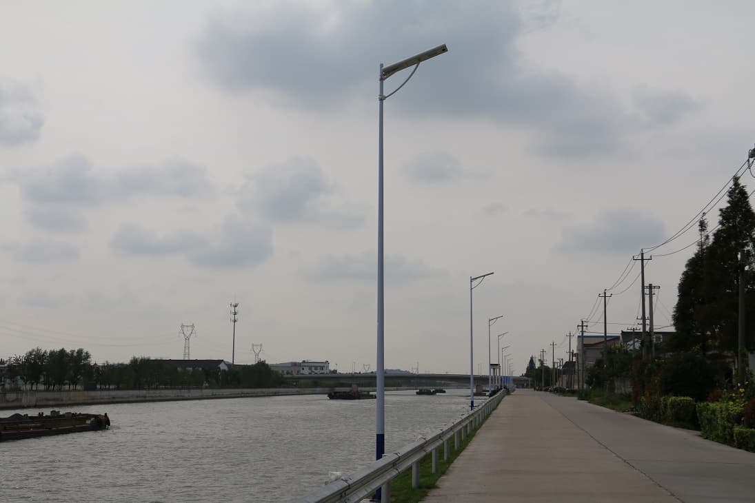 60W AIO-E integrated solar street light installed in village road.